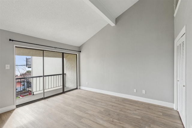 3931 Roma Ct, Rockwall, TX 75087 - unfurnished bedroom featuring access to outside, wood finished floors, and baseboards