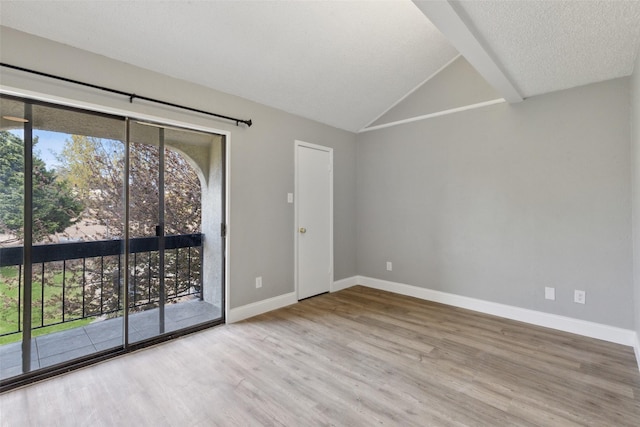 3931 Roma Ct, Rockwall, TX 75087 - unfurnished room with wood finished floors, baseboards, and vaulted ceiling