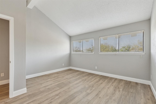 3931 Roma Ct, Rockwall, TX 75087 - empty room featuring light wood-type flooring, baseboards, and a textured ceiling