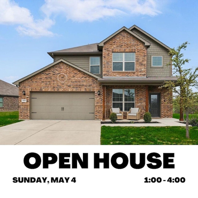 view of front of house featuring a garage, brick siding, and driveway