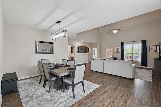 1616 Mackinac Dr, Crowley, TX 76036 - dining area featuring baseboards, arched walkways, and dark wood-style floors