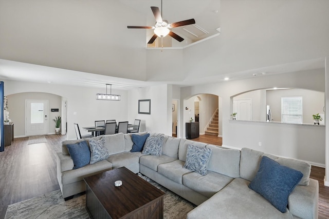 1616 Mackinac Dr, Crowley, TX 76036 - living area featuring a ceiling fan, baseboards, wood finished floors, arched walkways, and stairway