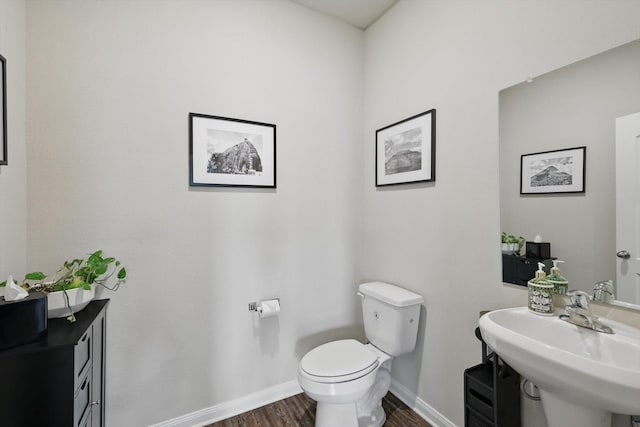 1616 Mackinac Dr, Crowley, TX 76036 - half bath featuring a sink, toilet, baseboards, and wood finished floors