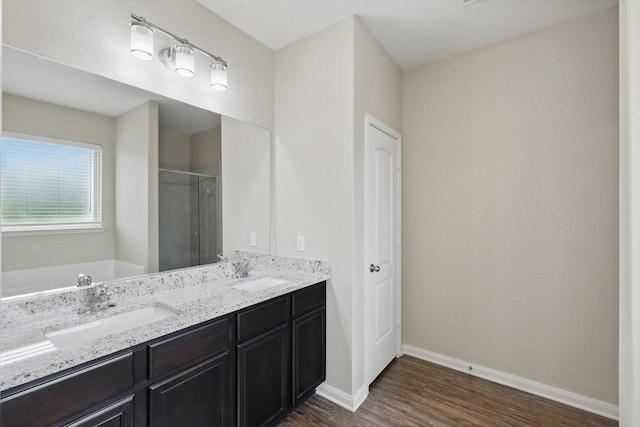 1616 Mackinac Dr, Crowley, TX 76036 - full bath with a sink, a stall shower, baseboards, and wood finished floors