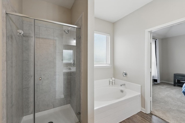 1616 Mackinac Dr, Crowley, TX 76036 - full bath with a stall shower, baseboards, a garden tub, and wood finished floors