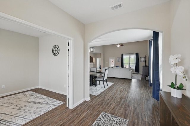 1616 Mackinac Dr, Crowley, TX 76036 - foyer entrance with visible vents, dark wood-style flooring, arched walkways, a ceiling fan, and baseboards