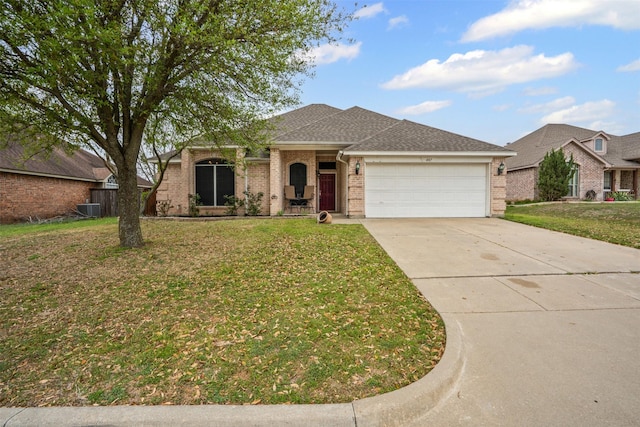 ranch-style house with a front yard, central air condition unit, brick siding, concrete driveway, and an attached garage