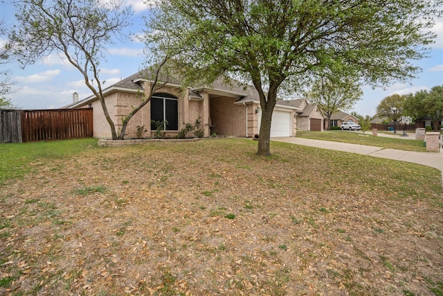 mid-century modern home with a front lawn, driveway, brick siding, an attached garage, and fence