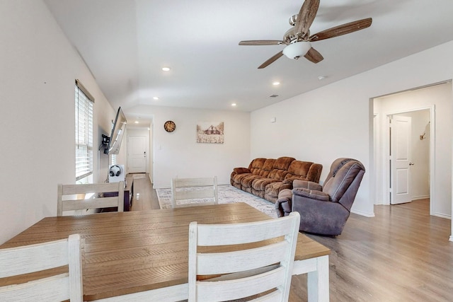 dining space featuring vaulted ceiling, recessed lighting, baseboards, light wood finished floors, and ceiling fan