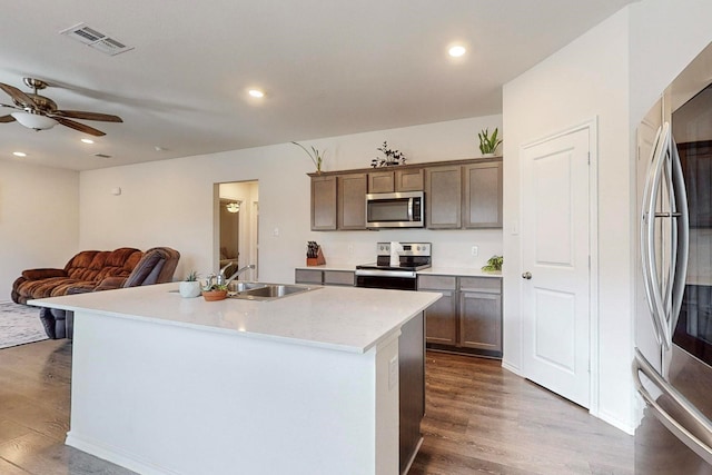 kitchen featuring recessed lighting, stainless steel appliances, dark wood-style floors, ceiling fan, and visible vents