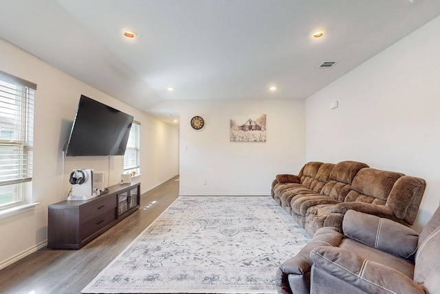 living room featuring recessed lighting, baseboards, light wood-style floors, and visible vents