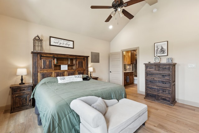 bedroom with baseboards, light wood-type flooring, high vaulted ceiling, and ensuite bathroom