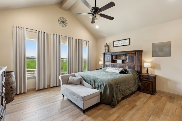 bedroom featuring high vaulted ceiling, a ceiling fan, light wood-style floors, baseboards, and beam ceiling
