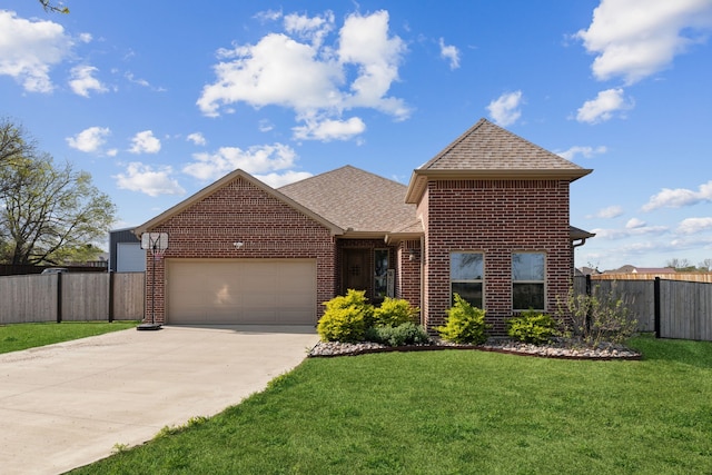 view of front of home featuring brick siding, an attached garage, a shingled roof, and fence
