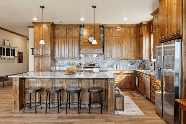 kitchen with crown molding, backsplash, appliances with stainless steel finishes, and premium range hood