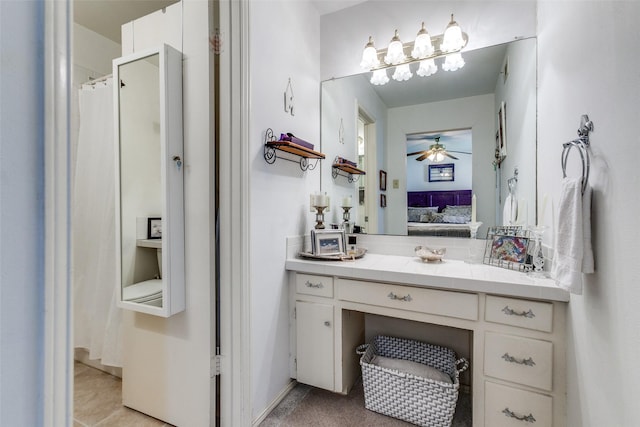 ensuite bathroom featuring connected bathroom, a ceiling fan, and vanity