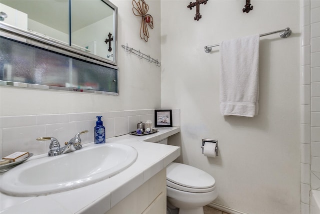 bathroom with toilet and vanity