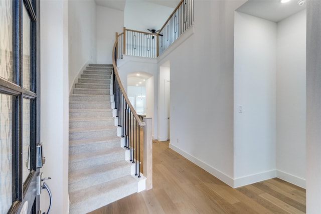 1716 Bradford Pear Way, Celina, TX 75078 - stairway with wood finished floors, baseboards, and a towering ceiling