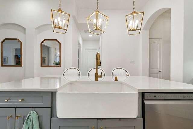 5108 Shallow Pond Dr, Little Elm, TX 76227 - kitchen with gray cabinets, stainless steel dishwasher, a chandelier, light countertops, and decorative light fixtures