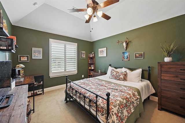 bedroom with baseboards, lofted ceiling, ceiling fan, and carpet