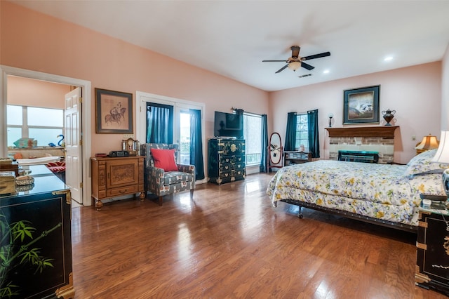 1207 Stafford St, Dallas, TX 75208 - bedroom with multiple windows, wood finished floors, recessed lighting, and a glass covered fireplace