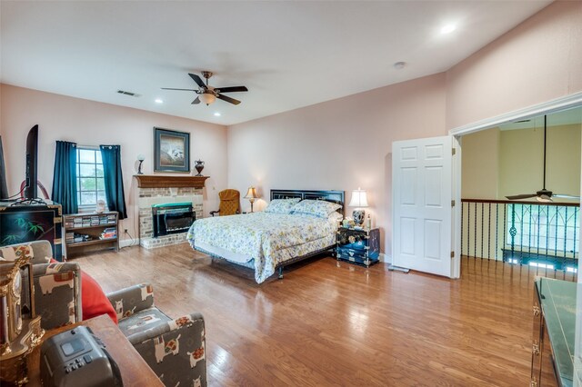 1207 Stafford St, Dallas, TX 75208 - bedroom with wood finished floors, a fireplace, recessed lighting, and baseboards