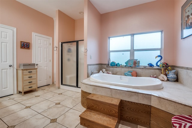 1207 Stafford St, Dallas, TX 75208 - bathroom featuring a shower stall, a garden tub, and tile patterned floors
