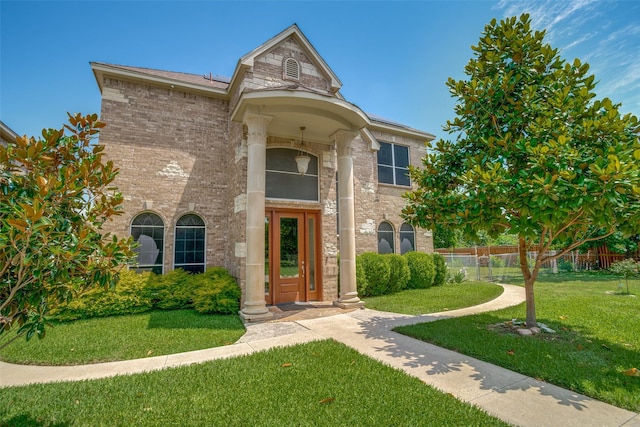 1207 Stafford St, Dallas, TX 75208 - view of front of home with a front yard and brick siding