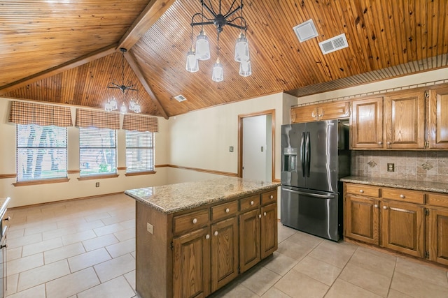 2111 Meadowview Dr, Keller, TX 76262 - kitchen with visible vents, stainless steel fridge, light tile patterned floors, and tasteful backsplash