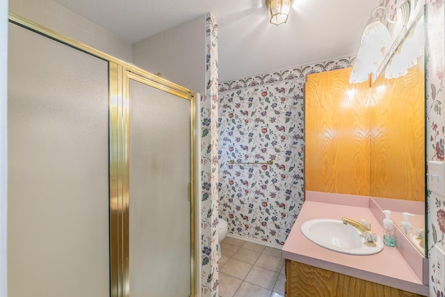 2111 Meadowview Dr, Keller, TX 76262 - bathroom with toilet, baseboards, wallpapered walls, tile patterned flooring, and a shower stall