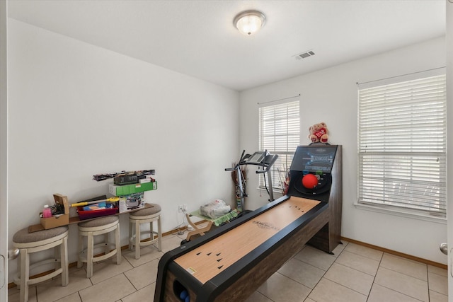 playroom with visible vents, baseboards, and light tile patterned floors