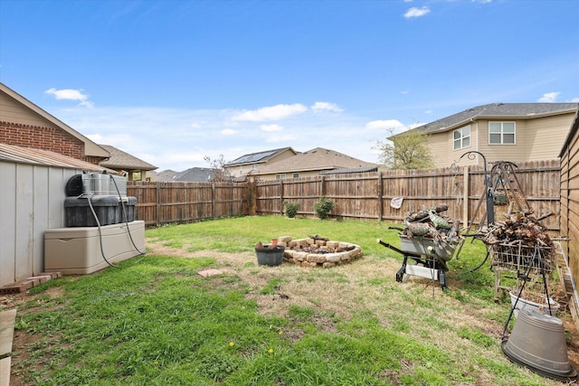 view of yard featuring a fenced backyard and an outdoor fire pit