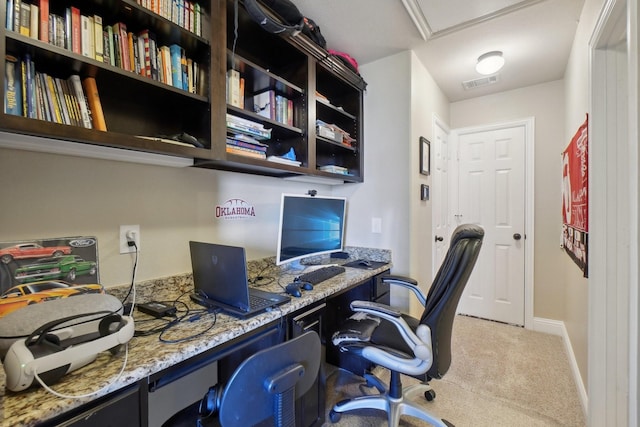 office area featuring light carpet, baseboards, and visible vents