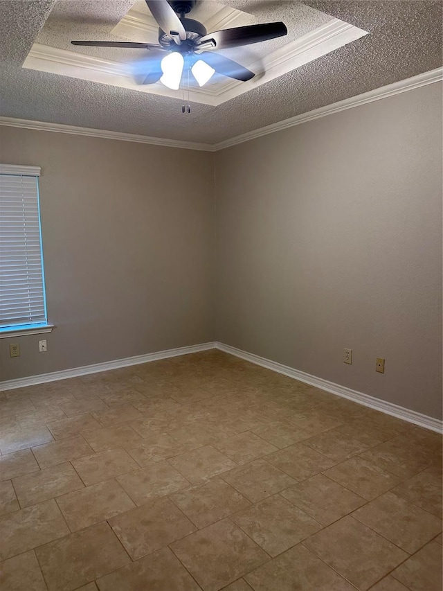 spare room with a textured ceiling, ornamental molding, and a ceiling fan