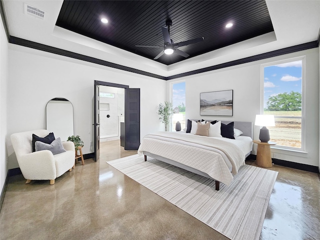 bedroom featuring visible vents, baseboards, a raised ceiling, and finished concrete flooring