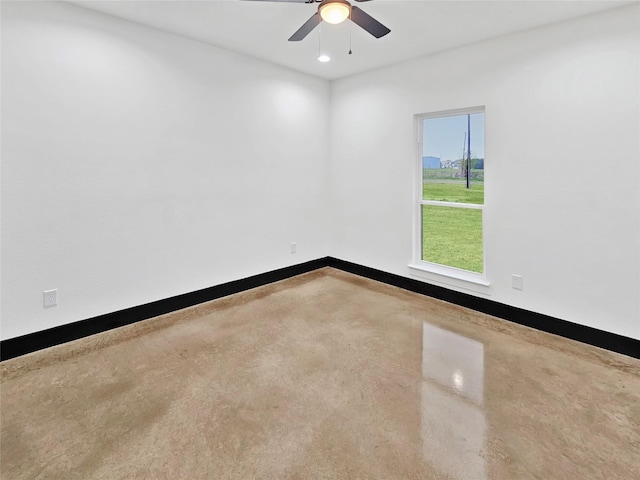 unfurnished room with recessed lighting, concrete floors, baseboards, and a ceiling fan