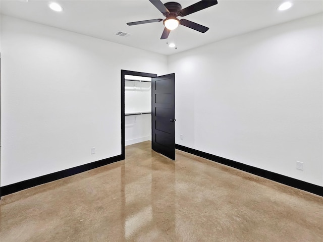 spare room with visible vents, baseboards, recessed lighting, and finished concrete flooring