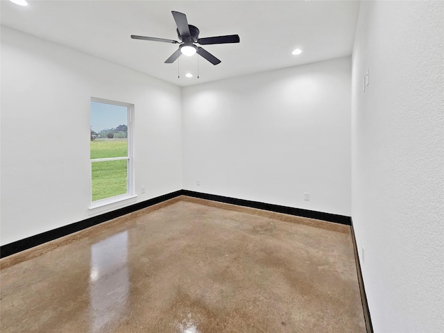 unfurnished room with baseboards, recessed lighting, ceiling fan, and finished concrete floors