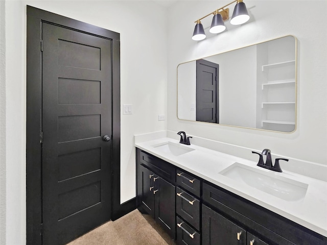 bathroom featuring a sink and double vanity