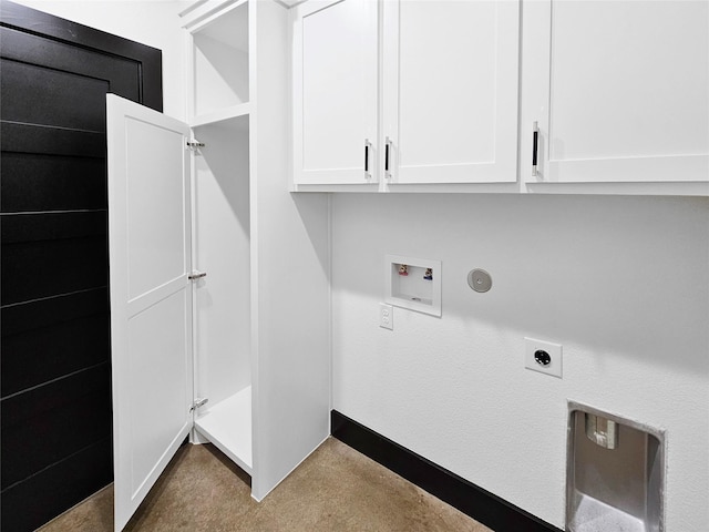 washroom featuring baseboards, hookup for a washing machine, electric dryer hookup, and cabinet space