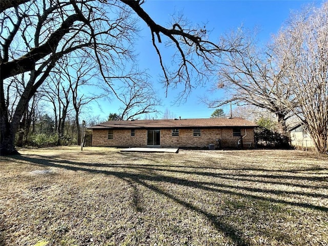 140 Vz County Road 2153, Canton, TX 75103 - rear view of house with a patio area, brick siding, and a yard