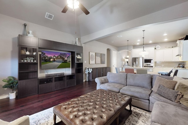 living room featuring arched walkways, a ceiling fan, visible vents, recessed lighting, and dark wood-style floors