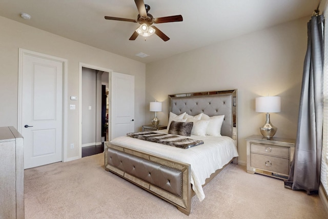 bedroom with light carpet, ceiling fan, baseboards, and visible vents