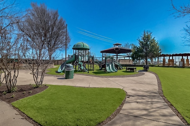 communal playground featuring a yard