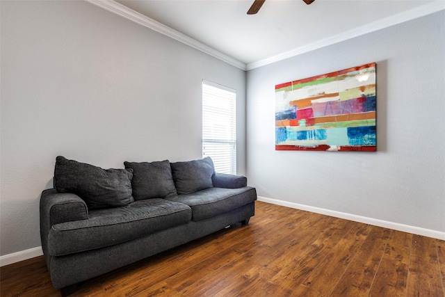 living room featuring ceiling fan, wood finished floors, baseboards, and ornamental molding