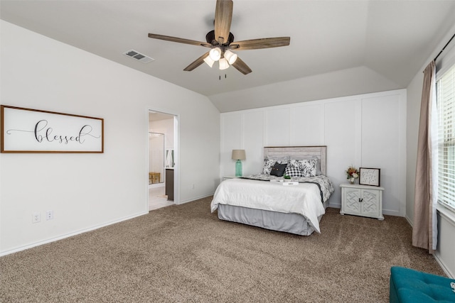 bedroom with multiple windows, lofted ceiling, visible vents, and carpet floors