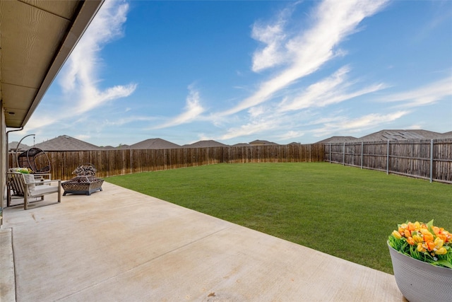 view of yard featuring a patio area and a fenced backyard