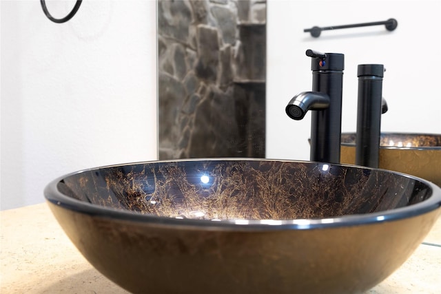 interior details featuring a sink and a soaking tub