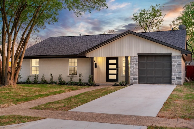 9035 Leaside Dr, Dallas, TX 75238 - view of front of home featuring a shingled roof, a garage, driveway, and a lawn