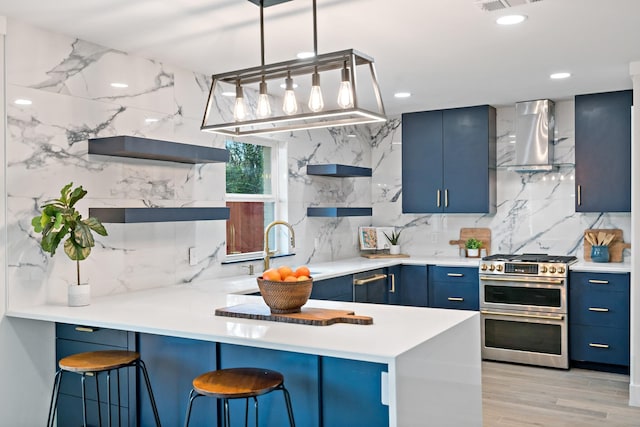 9035 Leaside Dr, Dallas, TX 75238 - kitchen featuring blue cabinetry, double oven range, open shelves, wall chimney range hood, and backsplash